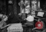 Image of family listening to radio broadcast Paris France, 1950, second 27 stock footage video 65675044610
