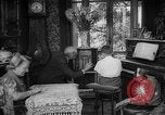 Image of family listening to radio broadcast Paris France, 1950, second 28 stock footage video 65675044610