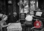 Image of family listening to radio broadcast Paris France, 1950, second 29 stock footage video 65675044610