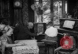 Image of family listening to radio broadcast Paris France, 1950, second 31 stock footage video 65675044610
