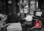 Image of family listening to radio broadcast Paris France, 1950, second 32 stock footage video 65675044610
