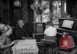 Image of family listening to radio broadcast Paris France, 1950, second 34 stock footage video 65675044610