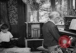 Image of family listening to radio broadcast Paris France, 1950, second 35 stock footage video 65675044610