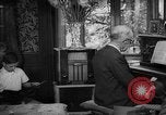 Image of family listening to radio broadcast Paris France, 1950, second 36 stock footage video 65675044610