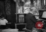 Image of family listening to radio broadcast Paris France, 1950, second 37 stock footage video 65675044610