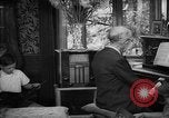 Image of family listening to radio broadcast Paris France, 1950, second 38 stock footage video 65675044610