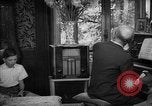 Image of family listening to radio broadcast Paris France, 1950, second 39 stock footage video 65675044610