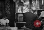 Image of family listening to radio broadcast Paris France, 1950, second 40 stock footage video 65675044610