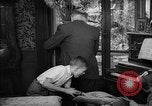 Image of family listening to radio broadcast Paris France, 1950, second 43 stock footage video 65675044610