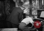 Image of family listening to radio broadcast Paris France, 1950, second 44 stock footage video 65675044610
