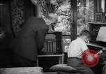 Image of family listening to radio broadcast Paris France, 1950, second 46 stock footage video 65675044610