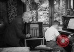 Image of family listening to radio broadcast Paris France, 1950, second 48 stock footage video 65675044610