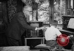 Image of family listening to radio broadcast Paris France, 1950, second 49 stock footage video 65675044610