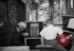 Image of family listening to radio broadcast Paris France, 1950, second 50 stock footage video 65675044610