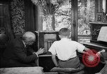Image of family listening to radio broadcast Paris France, 1950, second 51 stock footage video 65675044610