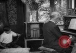 Image of family listening to radio broadcast Paris France, 1950, second 52 stock footage video 65675044610