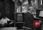 Image of family listening to radio broadcast Paris France, 1950, second 53 stock footage video 65675044610
