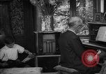 Image of family listening to radio broadcast Paris France, 1950, second 54 stock footage video 65675044610