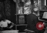 Image of family listening to radio broadcast Paris France, 1950, second 55 stock footage video 65675044610