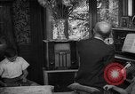 Image of family listening to radio broadcast Paris France, 1950, second 56 stock footage video 65675044610
