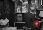 Image of family listening to radio broadcast Paris France, 1950, second 57 stock footage video 65675044610