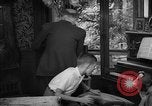 Image of family listening to radio broadcast Paris France, 1950, second 61 stock footage video 65675044610