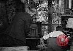 Image of family listening to radio broadcast Paris France, 1950, second 62 stock footage video 65675044610