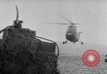 Image of helicopters lift supplies Korea, 1953, second 58 stock footage video 65675044739