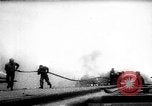 Standbild zwei F6fs Der VF-12 in Flammen auf die USS Randolph (CV-15) Pazifik, 1945, aus Sekunde 31 historischem Filmmaterial Videoclip 65675044901