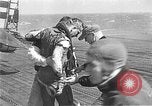Standbild zwei F6fs Der VF-12 in Flammen auf die USS Randolph (CV-15) Pazifik, 1945, aus Sekunde 37 historischem Filmmaterial Videoclip 65675044901