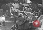 Image of scenes of Indian people at work, school and worship India, 1946, second 6 stock footage video 65675045102