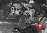 Image of scenes of Indian people at work, school and worship India, 1946, second 8 stock footage video 65675045102