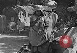 Image of scenes of Indian people at work, school and worship India, 1946, second 9 stock footage video 65675045102