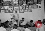 Image of scenes of Indian people at work, school and worship India, 1946, second 16 stock footage video 65675045102