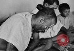 Image of scenes of Indian people at work, school and worship India, 1946, second 17 stock footage video 65675045102