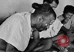 Image of scenes of Indian people at work, school and worship India, 1946, second 19 stock footage video 65675045102