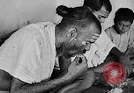 Image of scenes of Indian people at work, school and worship India, 1946, second 20 stock footage video 65675045102