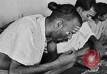 Image of scenes of Indian people at work, school and worship India, 1946, second 22 stock footage video 65675045102