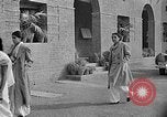 Image of scenes of Indian people at work, school and worship India, 1946, second 47 stock footage video 65675045102