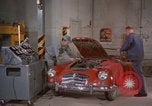 Image of repair a car Alaska USA, 1960, second 12 stock footage video 65675045185