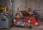 Image of repair a car Alaska USA, 1960, second 14 stock footage video 65675045185