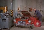Image of repair a car Alaska USA, 1960, second 15 stock footage video 65675045185