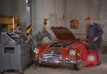 Image of repair a car Alaska USA, 1960, second 16 stock footage video 65675045185