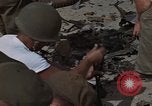Image of clean up Vietnam, 1965, second 30 stock footage video 65675045228
