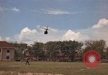 Image of Army UH-1B with red cross Vietnam, 1965, second 21 stock footage video 65675045232