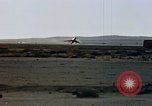 Image of crash of F-100 Supersabre jet caught in "sabre dance" California USA, 1956, second 9 stock footage video 65675045358