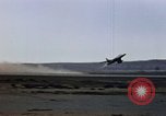 Image of crash of F-100 Supersabre jet caught in "sabre dance" California USA, 1956, second 16 stock footage video 65675045358