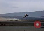 Image of crash of F-100 Supersabre jet caught in "sabre dance" California USA, 1956, second 20 stock footage video 65675045358