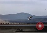 Image of crash of F-100 Supersabre jet caught in "sabre dance" California USA, 1956, second 21 stock footage video 65675045358
