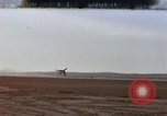 Image of crash of F-100 Super Sabre caught in "Sabre Dance" California USA, 1956, second 1 stock footage video 65675045359